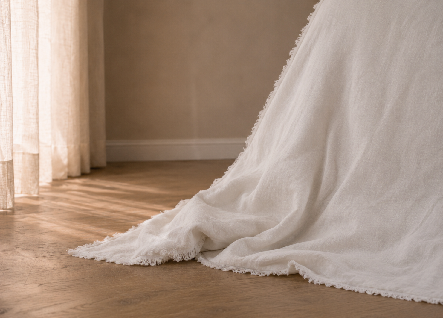 SOL Linen Whistler Frayed Linen Duvet Cover displayed on a bed with neutral bedding and decor, showcasing relaxed, textured linen bedding.